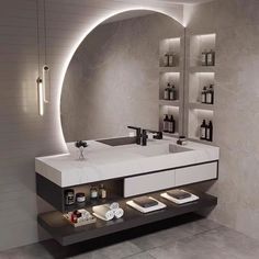 a modern bathroom with an oval mirror above the sink and shelves on the wall behind it