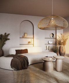 a living room filled with lots of furniture next to a wall mounted shelf and potted plants