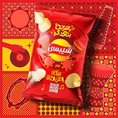 a bag of potato chips next to a red and yellow background with various items on it