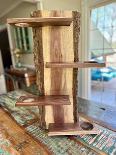 a wooden shelf sitting on top of a table