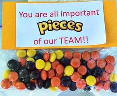 there is a bag with candy in it that says you are all important pieces of our team