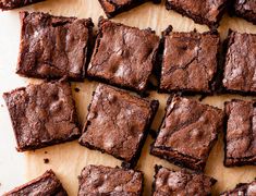 chocolate brownies cut into squares on a white surface