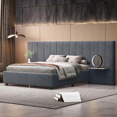 a bedroom with a bed, nightstands and rug on the floor in front of it