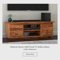 an entertainment center with 4 drawers and a flat screen tv mounted on the wall