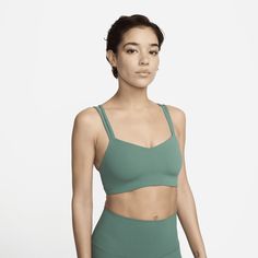 Feel calm and confident all day long in this strappy, gently supportive bra. A sewn-in 1-piece pad offers enhanced coverage and shaping while sweat-wicking technology helps keep you cool and comfortable. The fabric in the body and straps is lightweight, with softness that you can feel with every bend, stretch and shift. With a rounded V-neck to top it off, the bra has a clean finish that goes with any outfit. Nike Zenvy, Top Nike, Strappy Sports Bras, Padded Sports Bra, Nike Sports Bra, Low Impact Workout, Women Lifestyle, Support Bras, Sport Bra