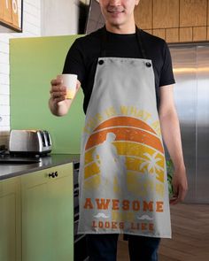 a man in an apron holding a cup