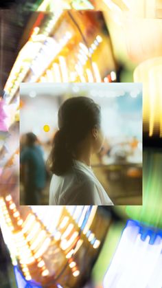 a blurry photo of a woman in front of a ferris wheel