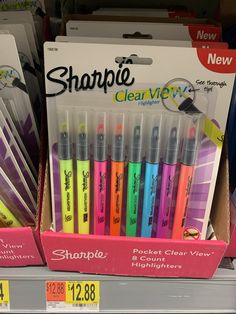 sharpie pens are on display for sale in a store shelf with other markers and highlighters