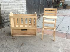 two wooden chairs sitting next to each other