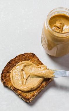 a peanut butter spread on top of a piece of bread