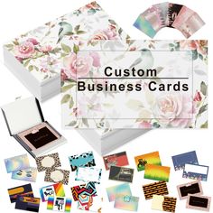 the business card box is full of cards and envelopes, with flowers on them