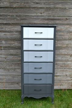 the drawers are painted gray and white