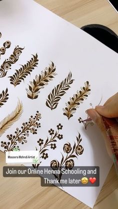 someone is doing something with gold on white paper that says join our online henna schooling and thank me later