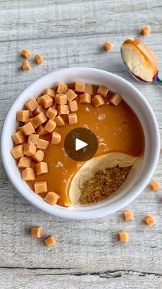 a bowl filled with peanut butter and caramel chunks