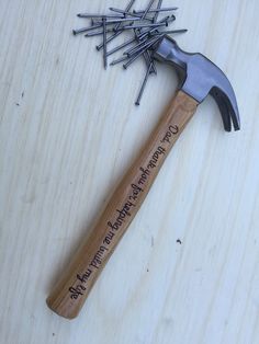 a hammer and some nails on a table