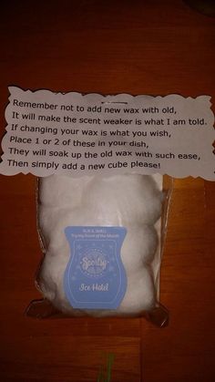 a bag of white powder sitting on top of a wooden table