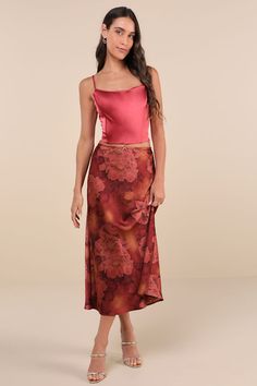 From your favorite ballet flats to strappy sandals, the Lulus Sleek Proposition Rust Floral Satin Bow Midi Skirt is ready to be paired to perfection! Glossy woven satin boasts a bold floral print and faded accents as it shapes this ultra-chic skirt that has a high, elasticized waist with subtle scalloped trim and a dainty ribbon bow at the center. The figure-skimming slip silhouette continues into a classic A-line skirt with a sweet midi hem. Fit: This garment fits true to size. Length: Mid-calf Midi Skirts, Chic Skirt, Chic Skirts, Bold Floral Print, Scalloped Trim, Satin Slip, Satin Bow, Ribbon Bow, Bottom Clothes