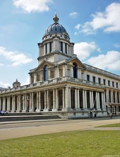 an old building with columns and a dome on top