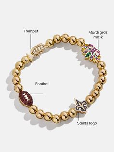 The New Orleans Saints NFL Charm Bracelet is the ultimate accessory for die-hard football fans. Each bracelet is a celebration of your favorite team, featuring the Saints logo along with other charms related to the team and its iconic location. Perfect for game days or everyday wear, this bracelet adds a touch of sports-inspired elegance to any outfit. This bracelet features 6mm gold ball beads. This is an officially licensed NFL product. Saints Logo, Beaded Charm Bracelet, Saints Football, Mardi Gras Mask, The Saints, Football Outfits, Football Gifts, Bead Charm Bracelet, New Orleans Saints