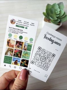 someone is holding up their instagram stickers to show the company's logo