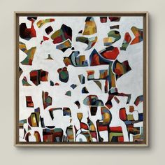 a painting hanging on the wall in front of a white wall with an abstract design