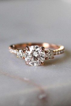 an engagement ring with three diamonds on it