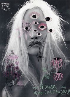 a woman with white hair and makeup has flowers painted on her face in black and pink