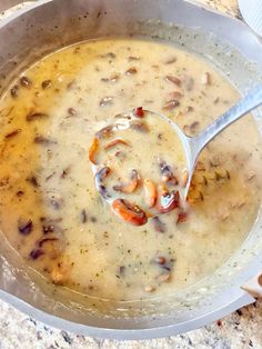 a spoon in a bowl filled with soup