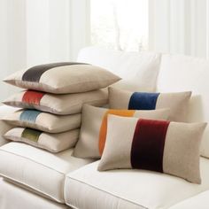 pillows stacked on top of each other on a couch