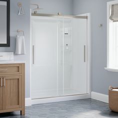 a bathroom with blue walls and white fixtures