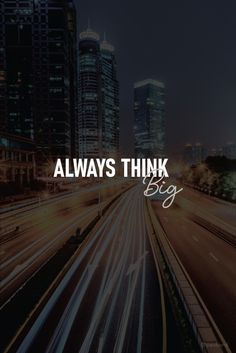 the words always think big in front of a cityscape with cars on it