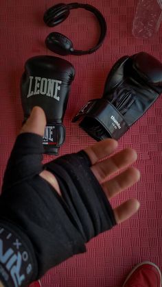 a person wearing boxing gloves and wrist wraps