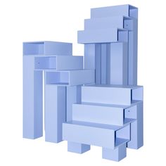 several stacks of blue boxes stacked on top of each other in front of a white background