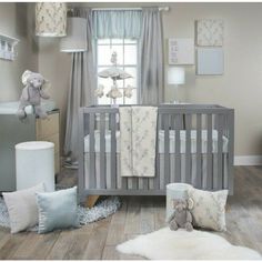 a baby's room with a crib and stuffed animals