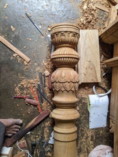 a wooden pillar being worked on in a woodworking shop