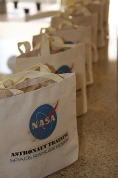 several nasa bags are lined up on the counter