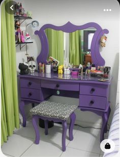 a purple vanity with a stool in front of it