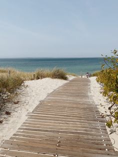 a wooden walkway leading to the beach