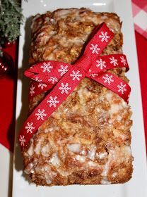 two pieces of granola sitting on top of a white plate next to a christmas tree