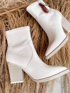 Step out in style with the Rachell Bootie! This classic neutral pointed toe bootie is the perfect finishing touch to any outfit - available in ivory or black, so you can choose the look that best suits your style. Make a statement with your footwear! Oh, and did we mention it looks amazing? 3 inch heel Fitted Cream Boots With Pointed Toe, Cream Pointed Toe Fitted Boots, White Mid-calf Boots With Stacked Heel For Fall, Fitted Cream Pointed Toe Boots, Cream Colored Fitted Heeled Boots With Pointed Toe, Trendy White Heeled Boots For Fall, Fitted Pointed Toe Booties For Spring, Trendy Pointed Toe Boots For Fall, Spring Fitted Pointed Toe Booties