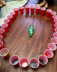 several cups arranged in the shape of a heart on a table