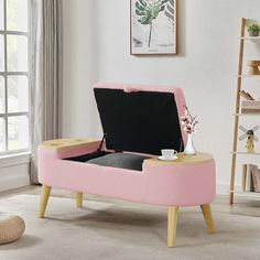 a pink and black storage bench in a living room