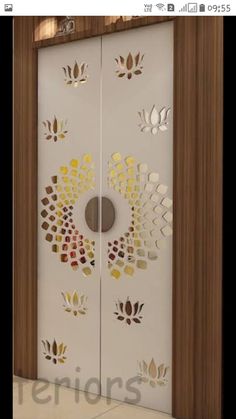 an open door with decorative designs on the front and side panels in gold, white and brown