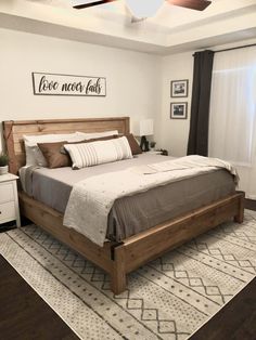 a bedroom with a large bed and wooden furniture in it's centerpieces