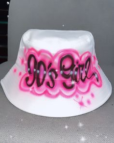 Designs by Galveston Airbrush! ♡ Feel free to contact me with any questions or custom orders. ✧ Our Designs on these cute bucket hats are handmade with the artists' skilled Hands and that makes each item unique ✧ My designs are Airbrushed on white or pink bucket hats. Please select desired color from the drop-down menu. Each design includes up to TWO names or words with up to THREE specified COLORS. SIZES: One Size for ADULTS DESIGN PLACEMENT: All designs are airbrushed on the FRONT of our cute Custom White Hats For The Beach, White Wide Brim Hat For Streetwear, White Wide Brim Hat For Gift, White Wide Brim Hat As Gift, Fun White Bucket Hat, Cute White Bucket Hat With Curved Brim, Cute White Bucket Hat With Short Brim, Adjustable White Bucket Hat, Cute White Short Brim Bucket Hat