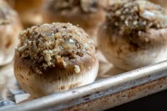 several baked goods are sitting on a baking sheet