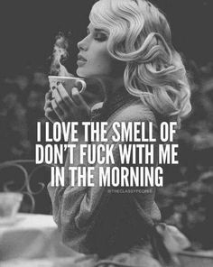 a woman drinking from a cup with the words i love the smell of don't f