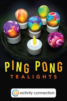 a plate with candles that have different colored balls on it and the words ping pong tealights