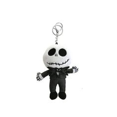 a keychain with a skeleton wearing a suit and bow tie on it's head