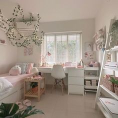 a bedroom with white walls and lots of plants in the window sill next to it